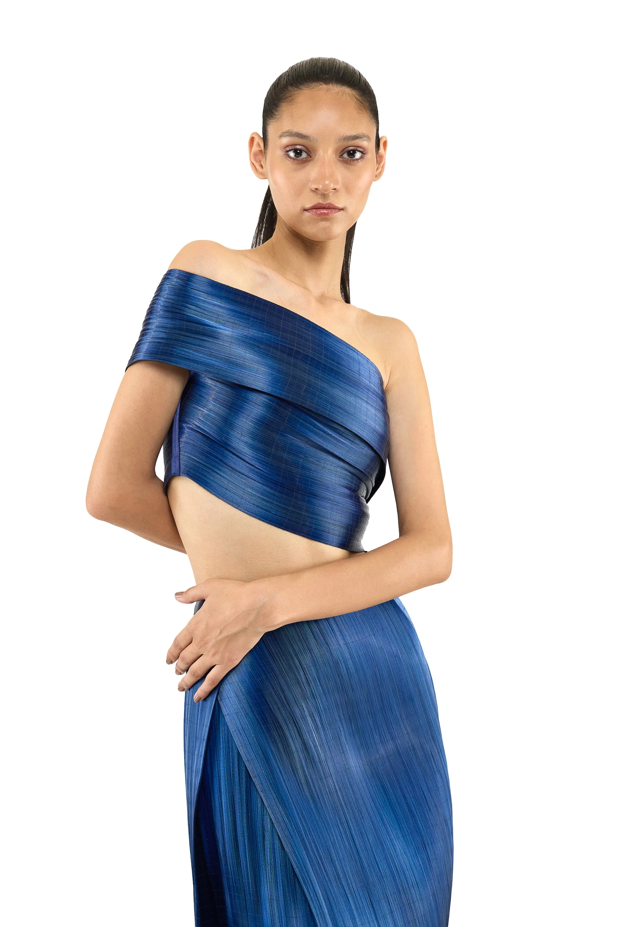 ONE SHOULDER METAL TOP PAIRED WITH PLEATED METAL SKIRT